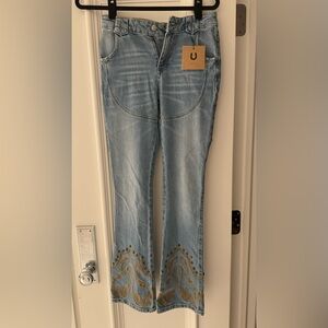 Understated leather NWT cowboy jeans 25
